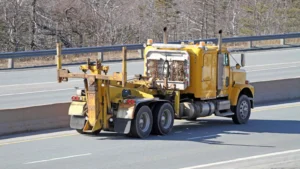 a yellow truck on the road